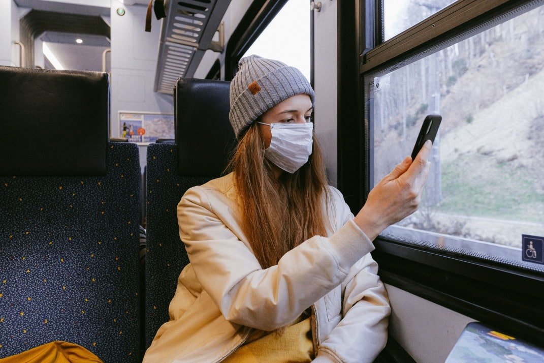 woman commuting in mask