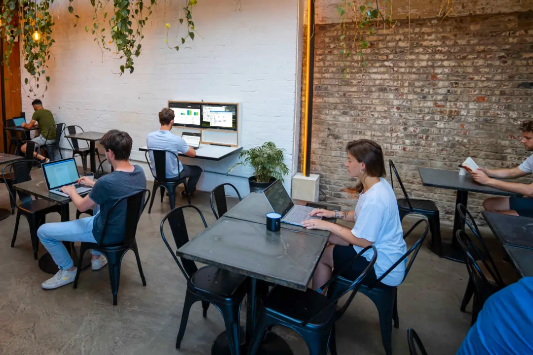 Fold out desk being used in an office/co-working enviroment.