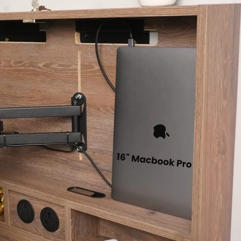 MacBook Pro drop down desk storage and additional plug sockets.